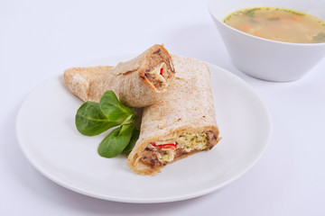 Tasty vegetarian tortillas on a white