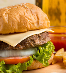 Burger In Roll Indicates Junk Food And Bun