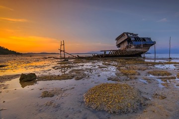 Fototapeta na wymiar Sunset with broken ship riau island Indonesia