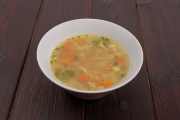 Tasty bread soup with vegetables on a table