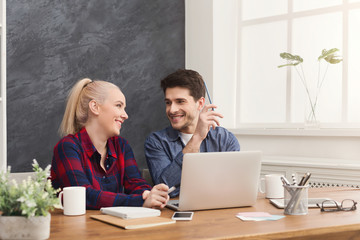 Couple of business partners work at modern office