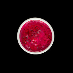 Red beet fresh juice. Top view. Isolated on black.