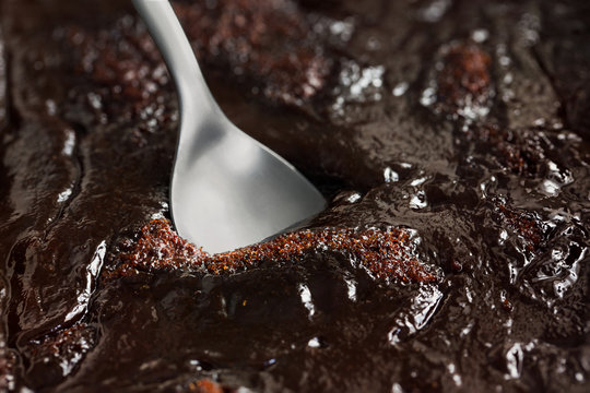 Traditional Finnish Easter dessert, m&auml;mmi, made of rye flour, seasoned salt, and Seville orange zest. Swedish memma pudding. Close up macro shot of mammi with a spoon