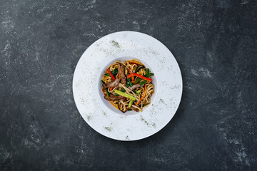 Stir fried noodles with veal and vegetables.