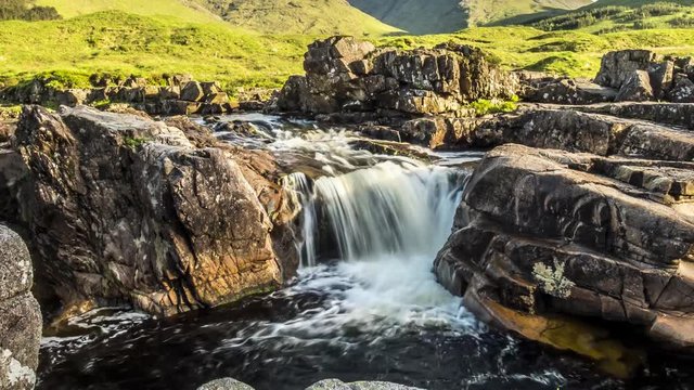 Dolly shot time lapse with long time exposure of the paradisal waterfall landscape in Glen Etive, Scotland - United Kingdom
