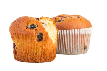 Fresh muffins. Whole, and with a piece bitten off