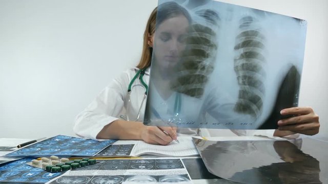 female doctor and x-ray of lungs