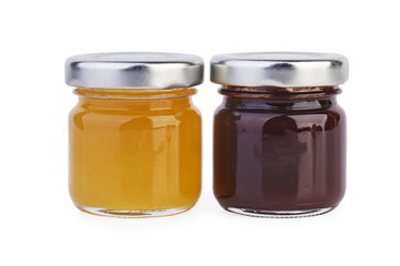 Two glass jars with different jam