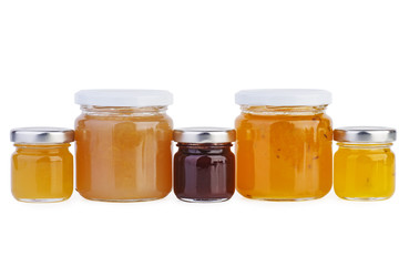 Glass jars with variety of jam