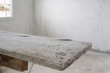 empty wood table at house building construction site