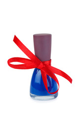 Obraz premium Bottle with blue nail polish tied with red bow