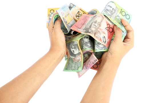 Asian woman hand taking group of colorful australian money banknote dollar (AUD) pile on white background like heart shape