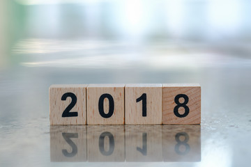 2018 New year concept. Close up of wooden number blocks on ground with copy space.