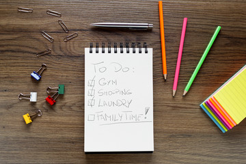 School notebook with pencil on vintage wooden table.