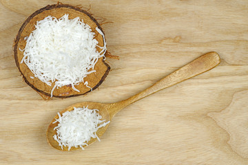 Grated coconut and wooden spoon