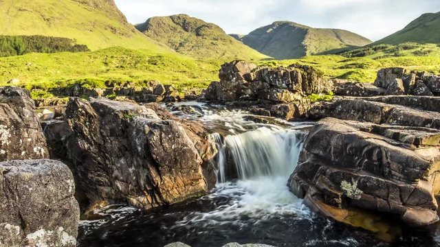 Dolly shot time lapse with long time exposure of the paradisal waterfall landscape in Glen Etive, Scotland - United Kingdom