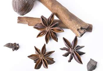 top view on anise, cinnamon and nutmeg on white background 
