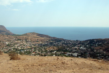 The landscape of the village of Morskoy on the Black Sea coast from the height of the adjoining village of sandy mountains.