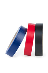 Rolls of red, blue and black insulation tape