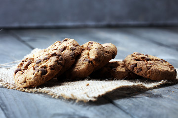 Chocolate cookies on wooden table. Chocolate chip cookies