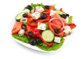 Square plate of greek salad isolated on white. fresh vegetable salad