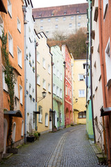 Fototapeta na wymiar Beautiful bright coloured street of Burghausen Bavaria leading up to the town castle