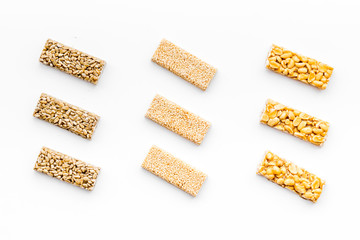 Sport bars for fast energy. White background top view pattern