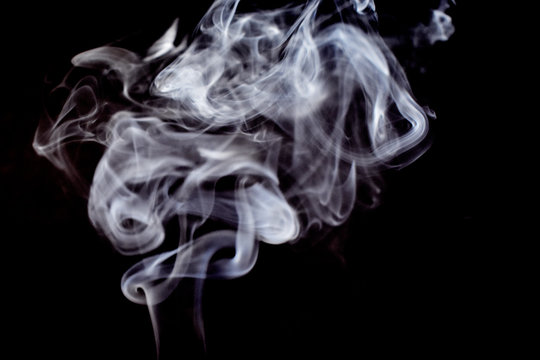 Smoke on a black background stock images. Abstract smoke background. Dark background with smoke
