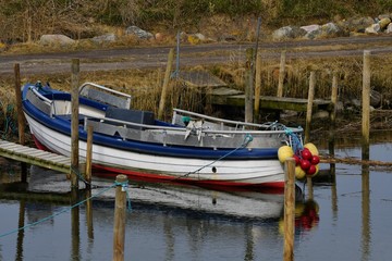 Obraz premium Colorful boat in danish harbor