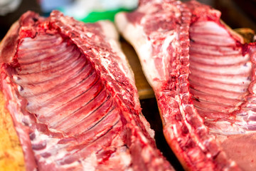 Traditional homemade pig slaughtering on the table in the village.