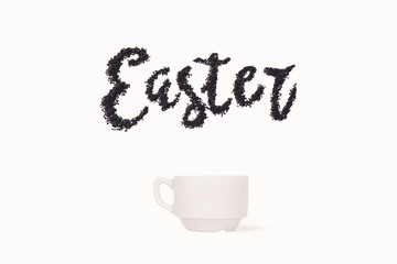 Word Easter from ground coffee with a cup with space for text 