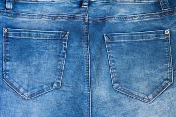 texture of blue jeans with back pockets