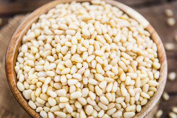 Shelled Raw Pine Nuts in the Wooden Bowl