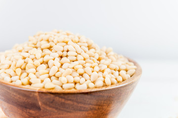 Shelled Raw Pine Nuts in the Wooden Bowl