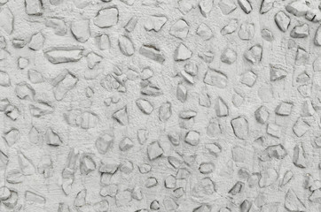 Concrete wall with rubble and stones.Grey.