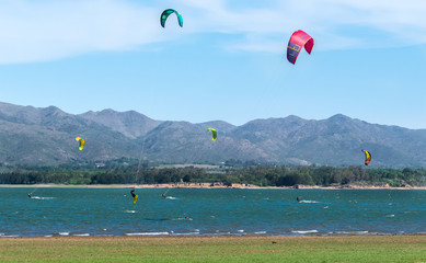 kite surf on lake with mountains in background