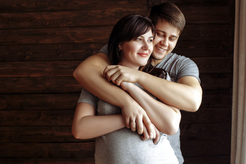 Naklejka premium young loving couple. Pregnant girl
