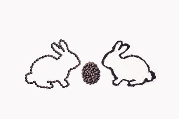 Easter bunny from coffee ground with egg on a white background