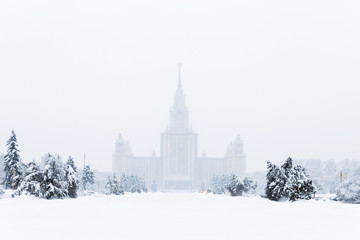 Fototapeta na wymiar Heavy snowfall in Moscow. houses and streets during blizzard