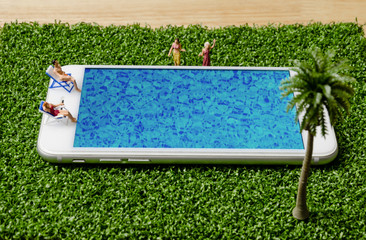 miniature people in swimsuit sitting and relax on mobile phone swimming pool