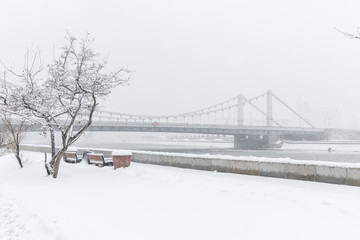 Heavy snowfall in Moscow. Snow-covered roads and Krymsky Bridge. Collapse of public services