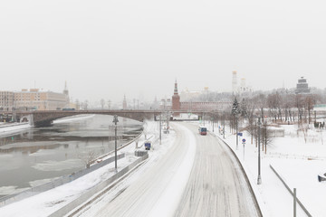 Heavy snowfall in Moscow. Snow-covered roads and Zaryadye Park with a view of the Kremlin and Bolshoy Moskvoretsky Bridge.
