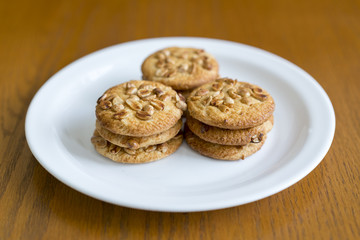 Cookies with peanuts on a white plate. Cookies close-up