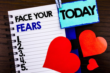 Announcement text showing Face Your Fears. Concept meaning Challenge Fear Fourage Confidence Brave Bravery written on notebook book paper on the wooden background Today Love Heart.