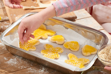 raw cookies in baking tray, sweet food concept