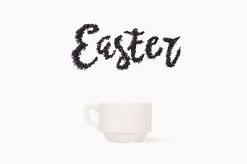 Word Easter from ground coffee with a cup with space for text 