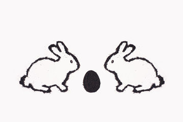 Easter bunny from coffee ground with egg on a white background