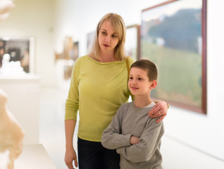 mother and son enjoying expositions in museum