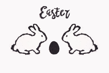 Easter bunny from coffee ground with egg on a white background