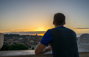 Fototapeta na wymiar Man enjoying sunset in Rome